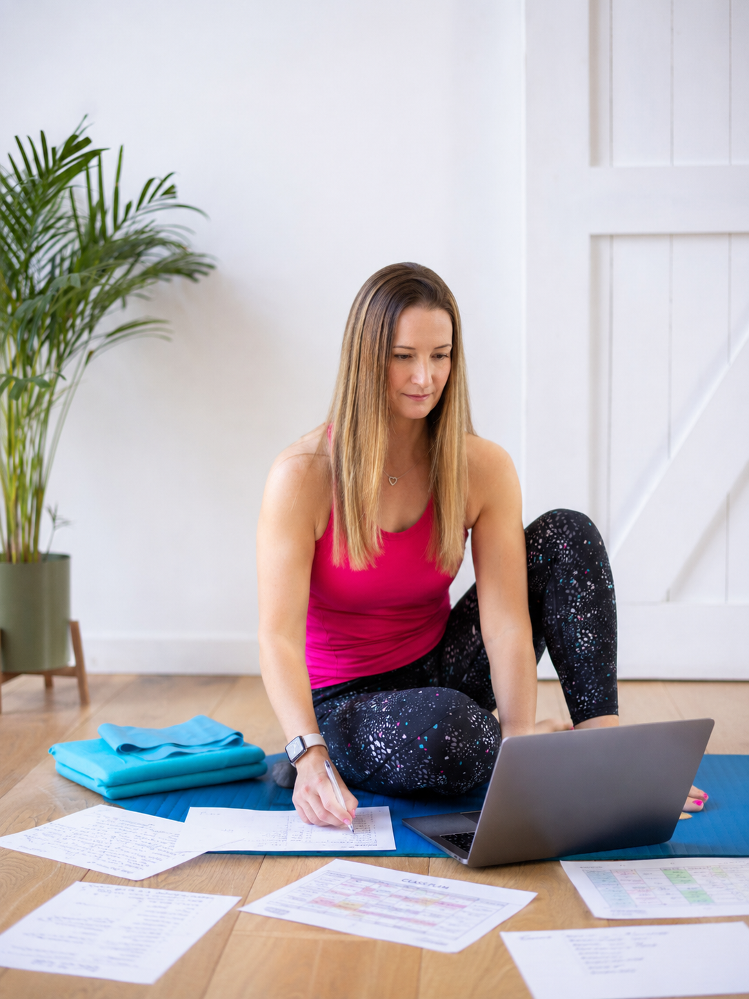 Emma Lovelock planning mat Pilates class plans at her desk